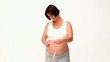 Brunette pregnant woman with a measuring tape