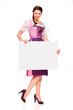 Pretty young girl with dirndl dress holding white board