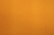 Texture of dense cardboard with yellow velvety coating Texture of dense cardboard with yellow velvety coating