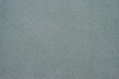 Texture of dense cardboard with grey velvety  coating