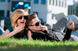 Emotional teenage couple photographing outdoor