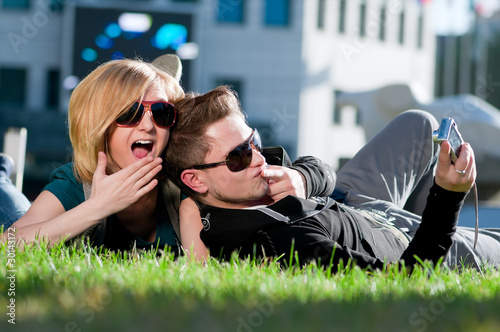 Photo: Emotional teenage couple photographing outdoor Emotional teenage couple photographing outdoor