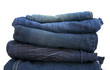 folded new blue jeans on a white background folded new blue jeans on a white background