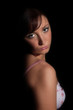 Portrait of young girl in lingerie over black background Portrait of young girl in lingerie over black background
