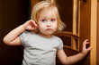 a sick girl is near the door