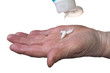 Elderly woman healing dry hands with hand lotion