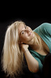 Long blond hair. Caucasian girl isolated on black background. Long blond hair. Caucasian girl isolated on black background.