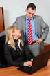 Businessman with his secretary in the office Businessman with his secretary in the office
