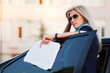 Young businesswoman with financial reports Young businesswoman with financial reports