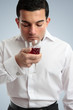 Man smelling red wine Man smelling red wine