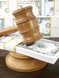 Auction gavel and dollars
