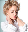 Photo: Woman with pain in her neck Woman with pain in her neck