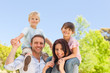 Parents giving  children a piggyback