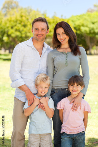 Photo: Portrait of a family in the park Portrait of a family in the park