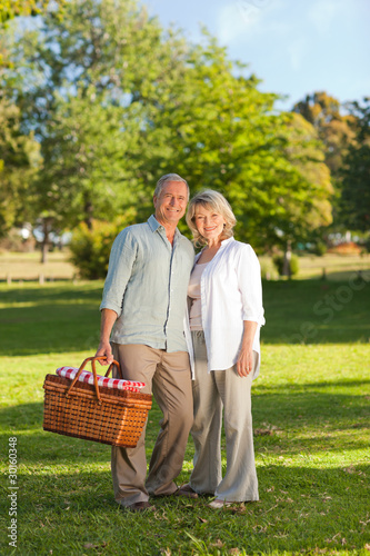 Photo: Retired couple looking for a place to picnicking Retired couple looking for a place to picnicking