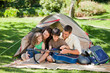 Joyful family camping