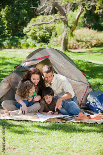 Photo: Joyful family camping Joyful family camping