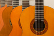 Row of classical acoustic guitars in musical store. Close-up vie Row of classical acoustic guitars in musical store. Close-up vie