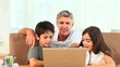 Family with a laptop