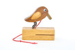 Cute wooden bird door knocker on white background