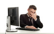 tired young businessman in black suit with computer