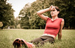 Relax in grass - tired woman after sport