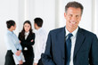 Happy smiling business man with colleagues