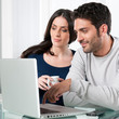 Couple with internet laptop