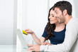 Surpised couple internet shopping