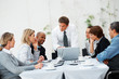 Executive going over proposal with colleagues Executive going over proposal with colleagues