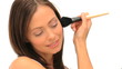 Wonderful brunette putting on make-up