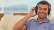 Casual man listening to music