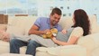 Lovely couple playing with a teddy bear