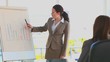 Business woman using a blackboard