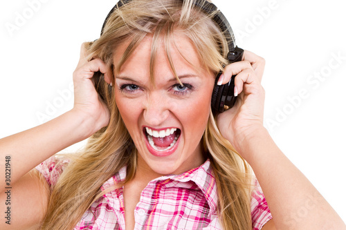 Photo: junge frau hört laute musik junge frau hört laute musik