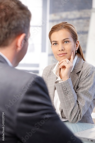 Photo: Businesswoman interviewing male applicant Businesswoman interviewing male applicant