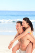 Man with his wife on the beach