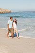Couple walking on the beach Couple walking on the beach