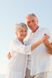 Senior couple dancing on the beach Senior couple dancing on the beach