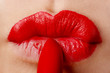 The woman draws lips