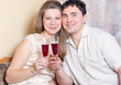 The man and the woman with glasses of wine