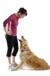 Young pretty woman plays with her dog