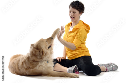 Photo: Young pretty woman plays with her dog Young pretty woman plays with her dog