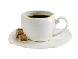A cup of coffee with pieces of sugar