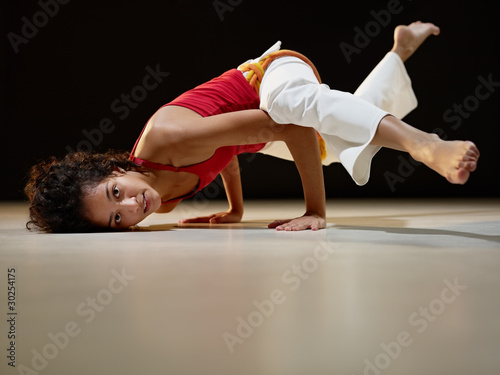 Photo: hispanic woman doing yoga exercise hispanic woman doing yoga exercise