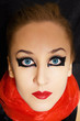 Portrait of beautiful young woman with bright makeup