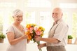 Portrait of happy senior couple with flower Portrait of happy senior couple with flower