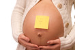 Pregnant woman with label on her belly