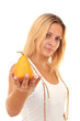 Girl gives a ripe pear