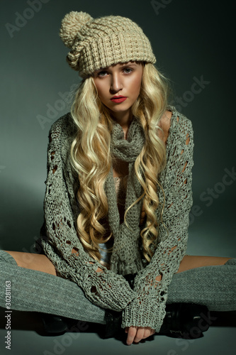 Photo: The blond girl on a gray background The blond girl on a gray background